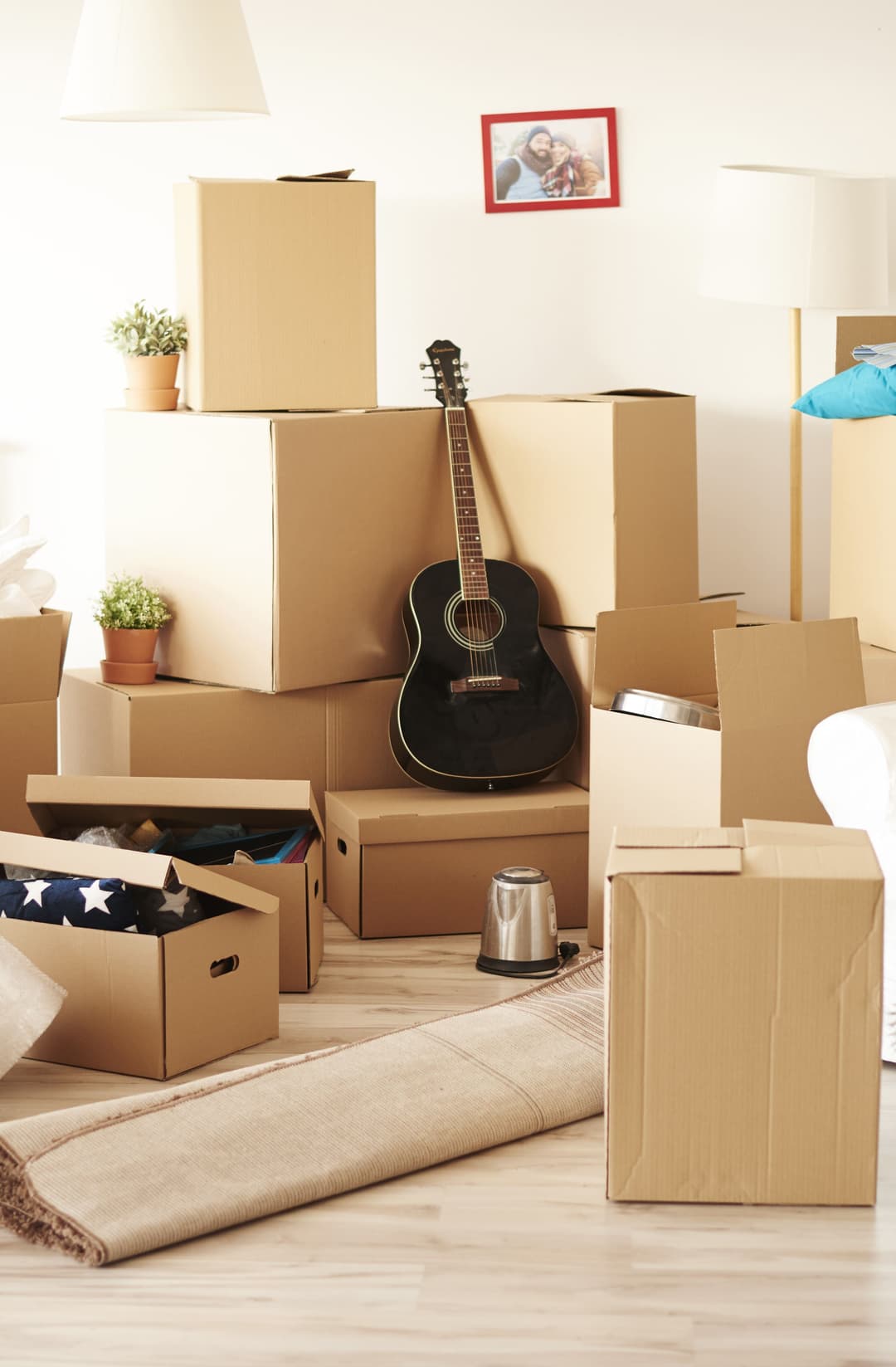 Room filled with boxes of household items, ready for moving or relocation